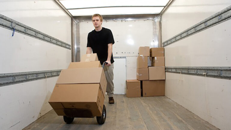 Man unloading boxes from truck